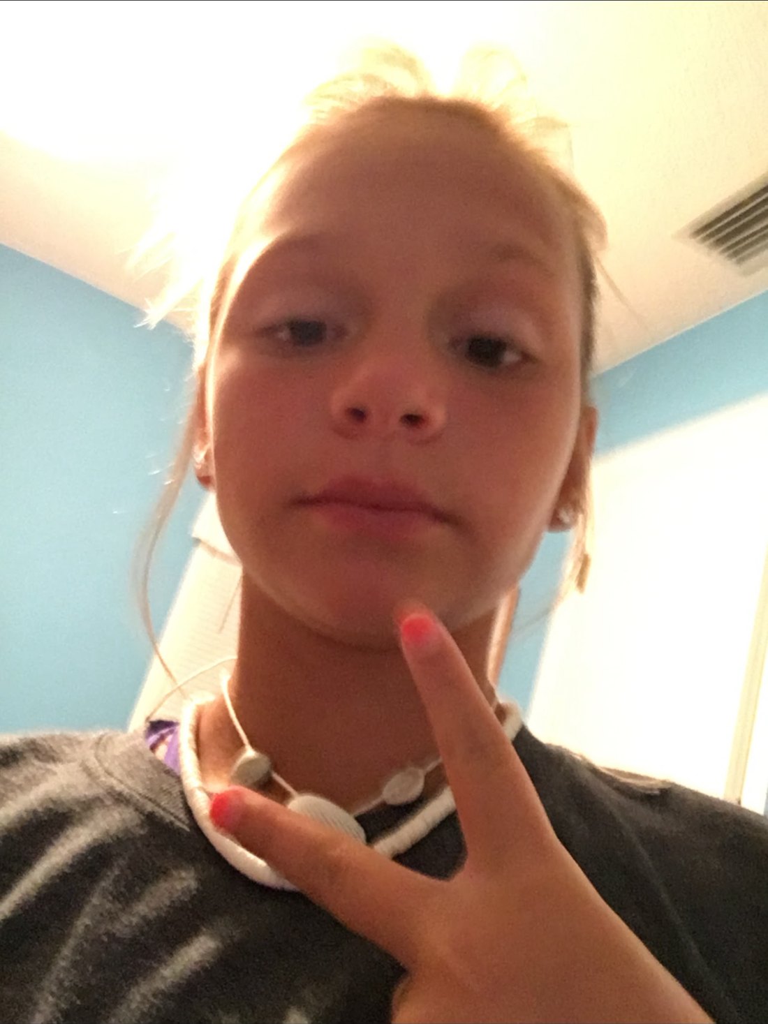 Abbi throwing a peace sign